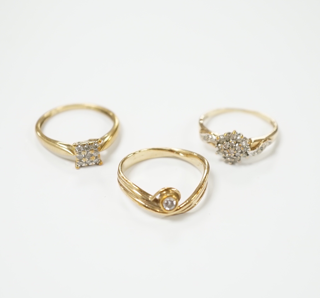 Three modern 9ct gold and diamond set rings, including solitaire and cluster, gross weight 5.9 grams.